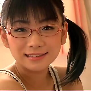 Japanese nerdy girl Ami Tokito in her pink bedroom