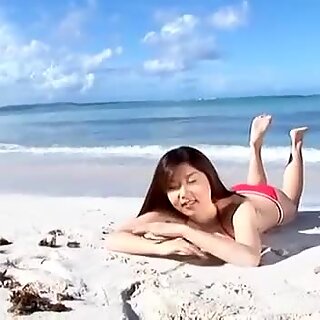 Scorching pale skin beauty China Fukunaga flaunts her curves on the beach